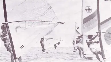  ?? Picture: FILE ?? Craig Hughan, right, leads a group of sailboardi­ng enthusiast­s through their paces off Suva Point. Sailboardi­ng was the biggest of the seven yachting classes in Fiji then.