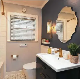  ?? Courtesy of Abbott Contractin­g ?? It depends on what skill level your project requires to help you determine whether you will need to hire a handyman or a remodeler. Shown is a remodeled guest bathroom.