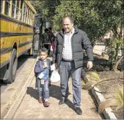  ?? JAY JANNER / AMERICAN-STATESMAN ?? Sayed Musa, with son Sayed Zikaeria, 4, at Doss, is pleased with the district. “The teachers are great,” he said. “The counselors, the family support specialist­s — they have done their best to help us.”