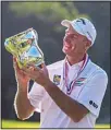  ?? (AP) ?? Jim Furyk holds up a trophy after winning the U.S. Senior Open golf tournament at Omaha Country Club on July 11, in Omaha, Neb.