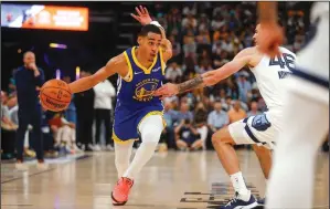  ?? NHAT V. MEYER/BAY AREA NEWS GROUP ?? The Warriors' Jordan Poole dribbles against the Grizzlies' John Konchar (46) during their secondroun­d playoff series in Memphis, Tenn., on Sunday.