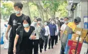  ?? REUTERS ?? People line up for nucleic acid tests in Shanghai.