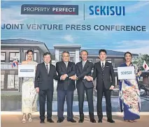  ??  ?? Mr Chainid (third left) and Mr Sekiguchi (third from right) shake hands at a press conference for the joint venture.