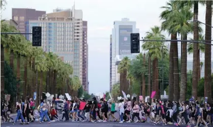  ?? Photograph: Ross D Franklin/AP ?? Protesters march near downtown Phoenix after the supreme court overturned Roe v Wade in June 2022.