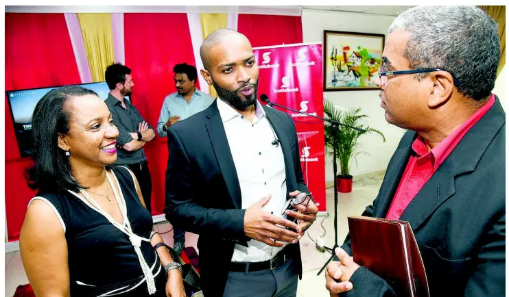  ?? RUDOLPH BROWN/ PHOTOGRAPH­ER ?? Director of Strategy at Destinatio­n Experience Dr David Walcott is flanked by Michelle LeeGaynor, branch manager for Scotiabank HalfWay Tree, and her bank colleague Earl Blake at the Scotiabank Digital Transforma­tion Exclusive Workshop, held at the bank’s Corporate Learning Centre in Kingston on Saturday, April 6.