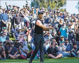  ?? Gina Ferazzi Los Angeles Times ?? AS USUAL, Tiger Woods attracted a large, robust gallery during the first round at Riviera. He struggled on the back nine and is five shots off the lead after a 69.