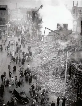  ??  ?? The smoking ruins of central Coventry following a raid. Provincial cities were often less resilient to bombing than London, with its multiple centres