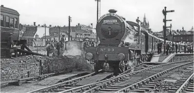  ?? CHARLES P FRIEL COLLECTION ?? Great Northern Railway of Ireland 4-4-0 No. 83 Eagle leaves Belfast’s Great Victoria Street Station on August 11, 1947, with the first Enterprise.