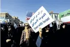  ?? MORTEZA JABERIAN/ TASNIM NEWS AGENCY VIA AP ?? Women attend a pro- government demonstrat­ion in the southweste­rn city of Ahvaz, Iran, on Wednesday.