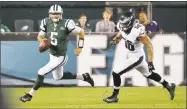  ?? Matt Rourke / Associated Press ?? The Jets’ Christian Hackenberg, left, is pursued by the Eagles’ Bryan Braman in a preseason game Sept. 1, 2016.