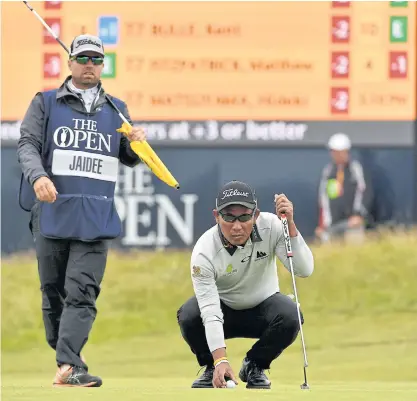  ??  ?? Thongchai Jaidee lines up a putt during Friday’s second round.