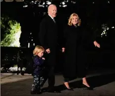  ?? Drew Angerer / Getty Images ?? President Joe Biden walks with grandson Beau Biden and first lady Jill Biden on Friday as they leave the White House and walk to Marine One on the South Lawn. The president is spending the weekend at his home in Wilmington, Del.