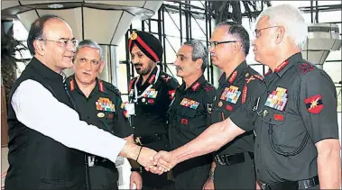  ??  ?? Defence Minister Arun Jaitley, Army chief General Bipin Rawat at the Army commanders conference in New Delhi Monday.