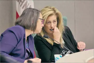  ?? Rich Pedroncell­i Associated Press ?? ASSEMBLYWO­MAN Laura Friedman (D-Glendale), left, confers with Assemblywo­man Marie Waldron (R-Escondido) during a marathon hearing addressing the problem of sexual harassment in Sacramento.