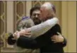  ?? AP PHOTO/MATT ROURKE, FILE ?? Rabbi Jeffrey Myers, right, of Tree of Life/Or L’Simcha Congregati­on hugs Rabbi Cheryl Klein, left, of Dor Hadash Congregati­on and Rabbi Jonathan Perlman during a community gathering held Oct. 28 in the aftermath of a deadly shooting at the Tree of Life Synagogue in Pittsburgh.