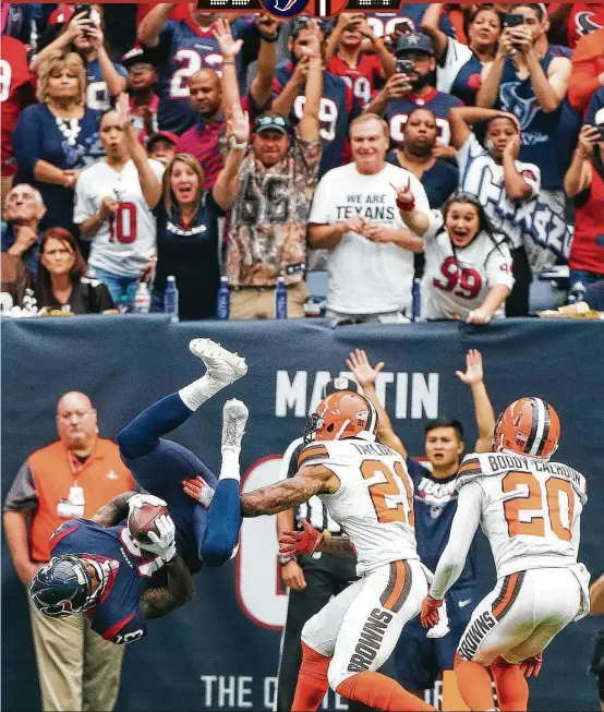  ?? Mark Mulligan / Houston Chronicle ?? Braxton Miller, flipping into the end zone for a touchdown in the second quarter, and the Texans’ offense had plenty of fun during Sunday’s win over the Browns.