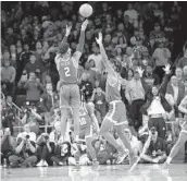  ?? MARCIO JOSE SANCHEZ AP ?? USC’S Jonah Mathews (2) makes a game-winning 3point basket over UCLA’S Jalen Hill with 1 second left.