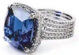  ??  ?? A 31.58 ct cushion-cut tanzanite and diamond ring, set in platinum