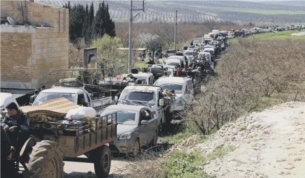  ?? PICTURE: AFP/GETTY IMAGES ?? 0 Syrian civilians flee Afrin as Turkish army units, allied with Ankara-backed forces, battle Kurdish fighters for control of the city