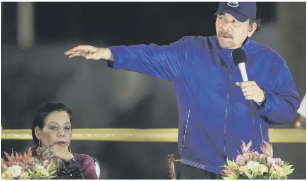  ??  ?? 0 Nicaragua’s President Daniel Ortega gives a speech during a ceremony in Managua, as first lady and vice president Rosario Murillo looks on