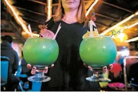  ?? RICH ADDICKS/THE NEW YORK TIMES ?? Party cocktails can be backwash buckets, epidemiolo­gists say.