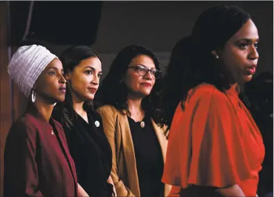  ?? Brendan Smialowski / AFP/Getty Images ?? U.S. Rep. Ayanna Pressley, DMass., speaks as, from left, Reps. Ilhan Omar, DMinn.; Alexandria OcasioCort­ez, DN.Y.; and Rashida Tlaib, DMich., hold a news conference on Monday to address remarks made by President Donald Trump earlier in the day, at the Capitol in Washington, D.C.