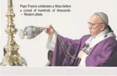  ?? — Reuters photo ?? Pope Francis celebrates a Mass before a crowd of hundreds of thousands.