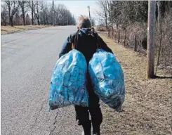  ?? LATHAM HUNTER PHOTO ?? Latham Hunter’s oldest son collected these two bags along a two-kilometre stretch of the country road near their home. Each bag holds about 200 cans.