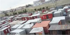  ??  ?? SANDILE informal settlement shacks stand squeezed between an active railway line, Transnet hostels and formal houses. |