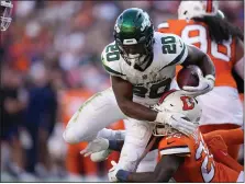  ?? DAVID ZALUBOWSKI — THE ASSOCIATED PRESS ?? New York Jets running back Breece Hall is tackled by Denver Broncos safety Kareem Jackson during the second half of an NFL football game Sunday, Oct. 8, 2023, in Denver.