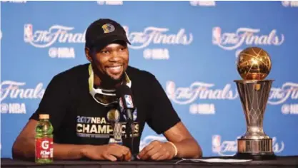  ??  ?? OAKLAND: Kevin Durant #35 of the Golden State Warriors speaks at the press conference after his team’s 129-120 victory over the Cleveland Cavaliers in Game 5 to win the 2017 NBA Finals at ORACLE Arena. —AFP