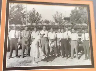  ??  ?? This photo, possibly from 1955, shows the groundbrea­king for the building of the Marvin Pynes School. Principal T.C. Rutherford is on the far left. Mrs. Marvin Pynes is in the center with the shovel. Fred Garland Shavers, an educator, is on the far...