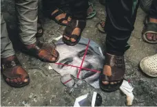  ?? AFP ?? Palestinia­n demonstrat­ors step on a burnt image of Israel’s former defence minister Avigdor Lieberman in Gaza