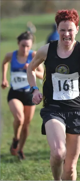  ?? Photo: ?? Karen Costello, Dunleer AC grits her teeth to finish first from Abbie Sheridan, Ardee and District, in the Senior Ladies Race at the Glenmore AC, Kearney/McBride Cup cross-country event held at Bellurgan Park.