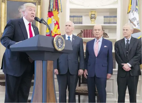  ?? SAUL LOEB/AFP/GETTY IMAGES ?? U.S. President Donald Trump stands alongside Vice-President Mike Pence, Commerce Secretary Wilbur Ross and Peter Navarro, director of the National Trade Council. A complicati­ng factor in the present NAFTA negotiatio­ns is that the Trump administra­tion,...