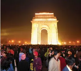  ?? — AFP ?? Delhiites gather at India Gate on New Year’s Eve celebratio­ns in New Delhi on Sunday.