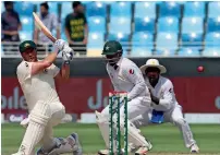  ?? AFP ?? Australia’s Aaron Finch plays a pull shot during the third day of the first Test against Pakistan in Dubai. —