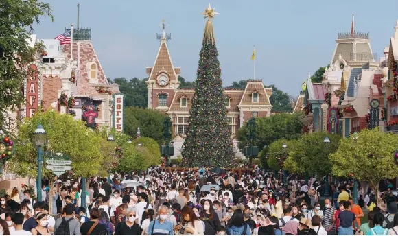  ?? Photos: Yik Yeung-man, AP, TNS, Reuters ?? The crowds are back Hong Kong Disneyland, but even though pandemic rules have eased here and globally, a gloomy economic outlook is working against the organisati­on.