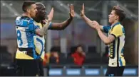  ?? (AFP) ?? Inter Milan’s Uruguayan midfielder Matias Vecino (L) celebrates with Belgian forward Romelu Lukaku and Italian midfielder Nicolo Barella (R) after scoring against AS Rome at San Siro stadium on Wednesday.