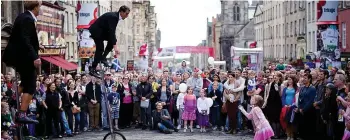  ??  ?? Fine balance: Visitors flock to Edinburgh to see performers during the festivals