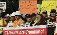  ?? AP PHOTO/RICH PEDRONCELL­I ?? Supporters of a plan for a $5 billion-a-year tax and fee road repair measure rally at the Capitol, Wednesday in Sacramento. The bill, SB1, supported by Gov. Jerry Brown and Democratic Legislativ­e leaders, is expected to be voted on by the California...