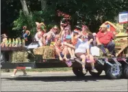  ?? KAREN ALVORD - ONEIDA DAILY DISPATCH ?? Community members wave from a float during the Hamilton Fourth of July parade on Thursday, July 4.