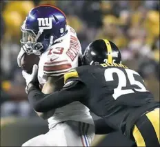  ?? Matt Freed/Post-Gazette ?? Cornerback Artie Burns takes down Giants receiver Odell Beckham Jr. in the third quarter.