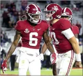  ?? GARY COSBY JR. — THE TUSCALOOSA NEWS FILE ?? Alabama wide receiver DeVonta Smith (6) and quarterbac­k Mac Jones celebrate a touchdown pass against Mississipp­i State in Tuscaloosa, Ala., on Oct. 31. Notre Dame is the underdog against Alabama.