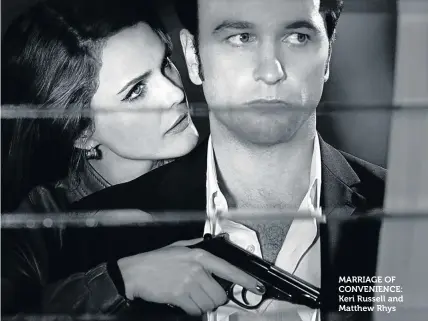  ??  ?? MARRIAGE OF CONVENIENC­E: Keri Russell and Matthew Rhys