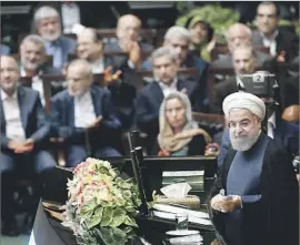  ?? Abedin Taherkenar­eh European Pressphoto Agency ?? THE REFORM-MINDED Rouhani, speaking before parliament at his inaugurati­on, abandoned the fiery rhetoric about civil rights from his election campaign.
