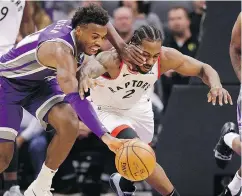  ?? — THE ASSOCIATED PRESS ?? Buddy Hield, left, and the Sacramento Kings couldn’t stop Kawhi Leonard and the Raptors from capturing Toronto’s 11th win in 12 games.