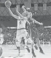  ?? Michael Bancale / Waco Tribune-Herald ?? Baylor guard Kristy Wallace (4) drives past Kentucky guard Maci Morris to score two of her 20 points during first-half action Thursday night.