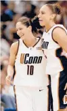  ?? AP FILE PHOTO ?? Bird, left, and Taurasi celebrate a regional semifinal win during the 2002 NCAA Tournament in Milwaukee.
