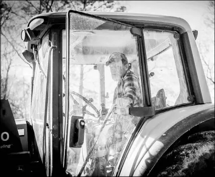  ?? EMILY KASK / THE NEW YORK TIMES ?? David Nunnery sits in a tractor at his dairy farm in Pike County, Miss. As the government shutdown goes into its third week, many farmers are struggling under the loss of crucial loans, payments and other services.